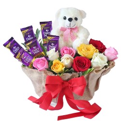 Admirable Teddy n Cadbury Chocolate with Mixed Roses in Basket