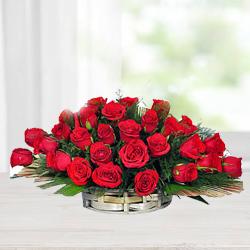 Cheerful Assortment of Red Roses with Fillers in a Basket