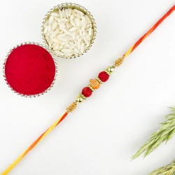 Kalash Rakhi with Glaring Red n Gold Beads to Canada-only-rakhi.asp