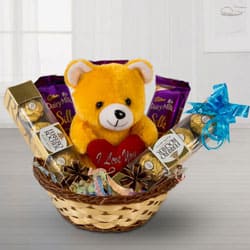 Delightful Chocolates with Love Teddy in a Basket to India
