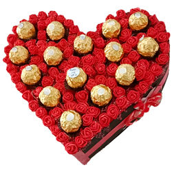 Ecstatic Heart Arrangement of Sapphire Hazelfills Chocolates on Roses to Rajamundri