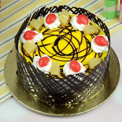 Enjoyable Eggless Pineapple Cake in Round Shape to Uthagamandalam