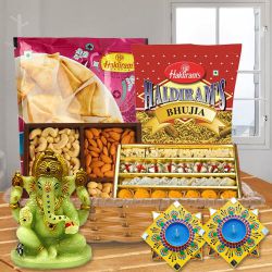 Wonderful Diwali Sweet n Snacks Gift Basket with Handmade Dot Mandala Art Diya to Tirur