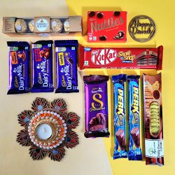 Perfect Chocolate Assortment N Designer T Light Candle to Punalur