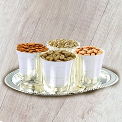 Delicious Dry Fruits added with Silver Glasses and Silver Tray to India