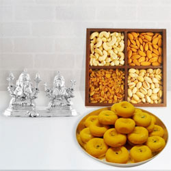 Appealing Ganesh Lakshmi Idol with Dry Fruits N Haldirams Kesaria Peda to Tirur