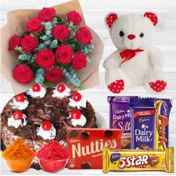 Ravishing 12 Dutch Red Roses with appetizing Cake and Cadburys Chocolate delight and Teddy Bear