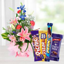 Stunning Assorted Flowers Arrangement with Mixed Cadbury Chocolate  to Karunagapally