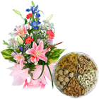 Enticing Kaju Barfi with Seasonal Flowers Bouquet 