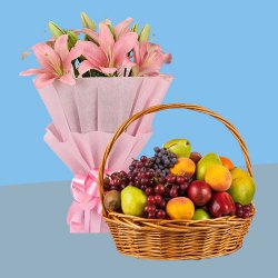 Charming Lilies Bouquet with Fresh Fruits Baskets to Uthagamandalam