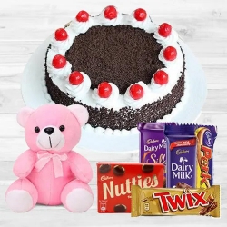One-of-a-Kind Black Forest Cake with Assorted Cadburys Chocolate and a Small Teddy to Alwaye