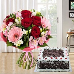 Majestic multi colored Seasonal Flowers along with tasty Black Forest Cake to Marmagao