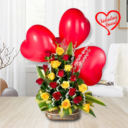Colorful Roses along with adorable heart Shaped Red Balloons to India