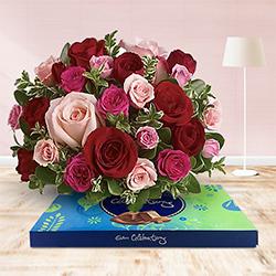 Yummy Assorted Chocolates and Pink N Red Roses Arrangement to Tirur