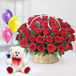 Radiant Red Roses Arrangement with Ferrero Rocher Chocolates to Marmagao