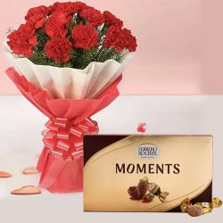Charismatic Red Carnations Bouquet with Ferrero Rocher Chocolate to Punalur