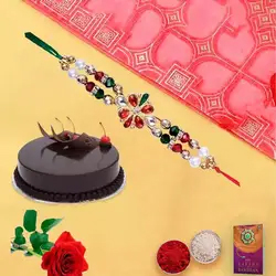 A Chocolate Cake  and single Red Rose with Free Designer Rakhi ,  Roli  Tilak an Chawal