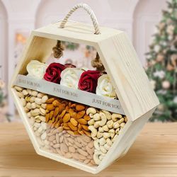 Tasteful Dry Fruits in Hexagonal Basket with Red Roses to Rajamundri