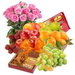 Scrumptious Fresh Fruit Basket with Haldiram Soan Papdi and Rose Bouquet to Alwaye