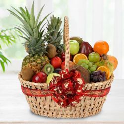 Magnificent Seasonal Fruits Basket with Handle for Moms Day to Punalur