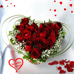 12 Dutch Red Roses in Heart Shape Arrangement to India