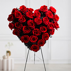 Two Dozen Red Roses in an alluring Heart Shape arrangement
