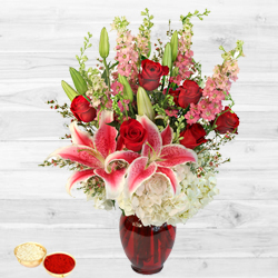 Gorgeous arrangement of fresh Lilies with free Roli Tilak and Chawal