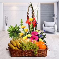 Splendid mixed Flowers including delicious Fresh Fruits to Punalur