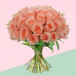 Beautiful Peach Roses Bouquet decked with Green Leaves