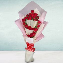 Charming Tissue Wrapped Bouquet of Red Roses