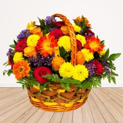 Charming Selection of Seasonal Flowers Accented with Greens
