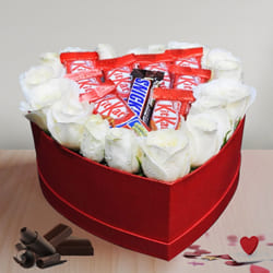 Breathtaking Display of White Roses N Chocolate in Heart Box to Punalur