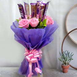 Delightful Bouquet of Pink Roses with Cadbury Dairy Milk to Muvattupuzha