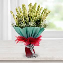 Exquisite Hand Bouquet of Tuberoses with Tissue Wrapping to Karunagapally