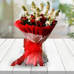 Classic Congratulations Bouquet of Red Roses n White Tuberose with Tissue Wrapping to Alwaye