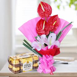Classy Bouquet of Red Anthurium n Pink Lilies with Ferrero Rocher to Karunagapally