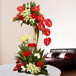 Magnificent Tall Arrangement of Red N White Flowers to Alwaye