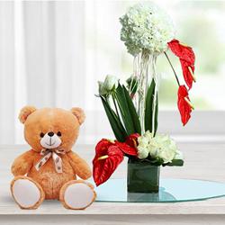 Artistic Flowers Display in Glass Vase with Cute Teddy to Rajamundri