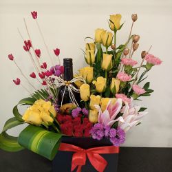 Spectacular Mixed Flowers Box Arrangement with Sparkling Fruit Juice to Karunagapally