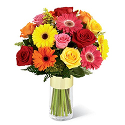 Multi-Hued Flowers arranged in a Glass Vase