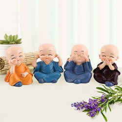 Attractive Set of 4 Buddha Monks Figurines to Ooty
