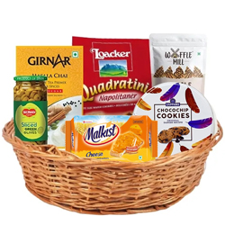 Marvelous Tea N Assorted Munchies Gift Basket to India