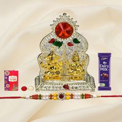 Beautiful Silver Plated Mandap with Golden Ganesh Laxmi Idol and Cadbury Dairy Milk Chocolate with Rakhi and Roli Tilak Chawal