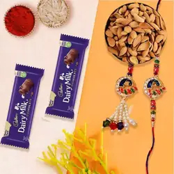 Lavish Bhaiya-Bhabhi Rakhi with Wholesome Almonds Combo to Rakhi-to-uk.asp