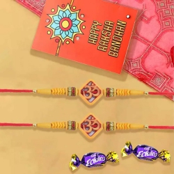 Gorgeous Pair of Om Rakhi with Chocolates, Roli Chawal Tika n Card to Usa-serch-by-price.asp
