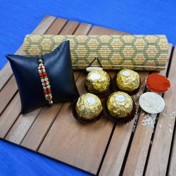 Fancy Golden Rakhi N Ferrero Rocher in Reusable Bamboo Box to Rakhi-to-world-wide.asp
