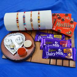 Charming Stone Rakhi Set with Paan Shape Thali n Assorted Chocolates to Rakhi-to-world-wide.asp