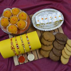 Fancy Stone Rakhi Set of 4 with Haldiram Sweets N Cookiemans Cookies to Rakhi-to-world-wide.asp