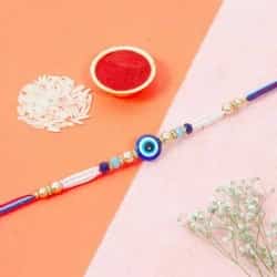 Impressive Royal Evils Eye Rakhi with Pearl String to World-wide-gifts-for-sister.asp