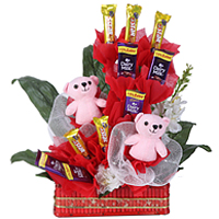 Blissful Array of Pink Teddies with Delicious Cadbury Chocolates arranged in a Basket